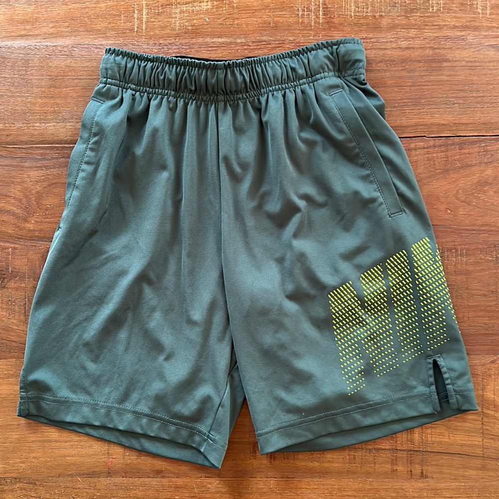 Boys Nike Dri Fit shorts. Olive Green with Neon Nike Brand emblem.